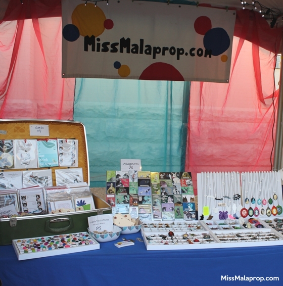craft show booth display: Miss Malaprop at Gretna Fest